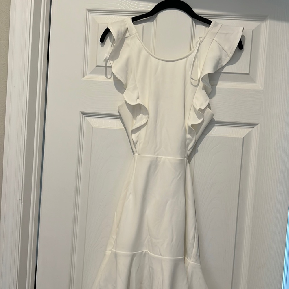White cutout mini dress with ruffles